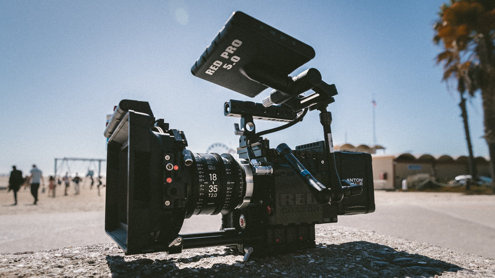 BEHIND THE CAMERA